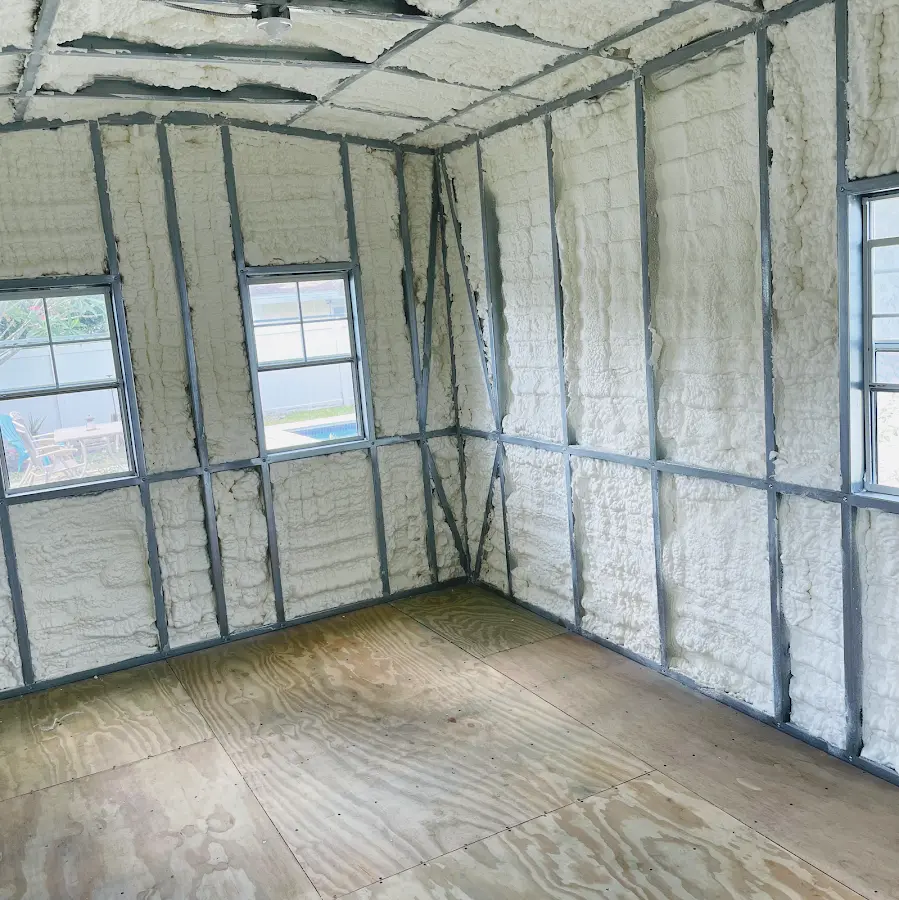 Closed-cell spray foam insulation applied to wall cavities in a residential project in Waukesha